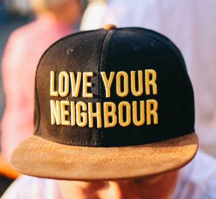 Love your neighbour hat